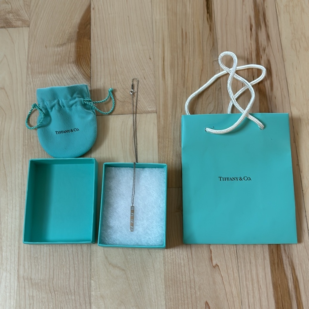 Tiffany & Co. Atlas bar Roman numeral pendant necklace